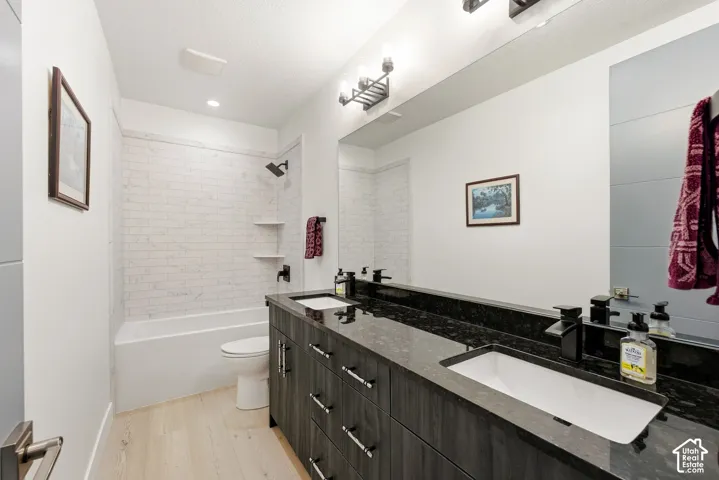 Double vanity with undermount sinks and dark stone countertop