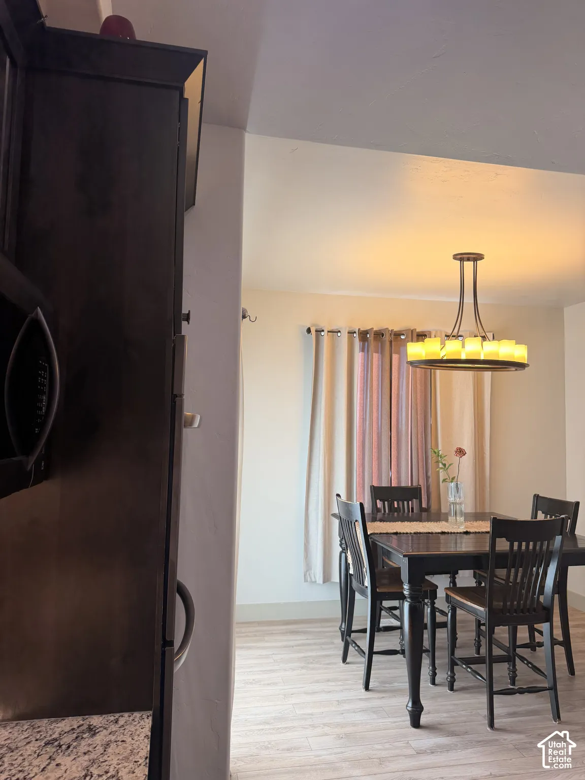 Wood-finish flooring extending into the dining area