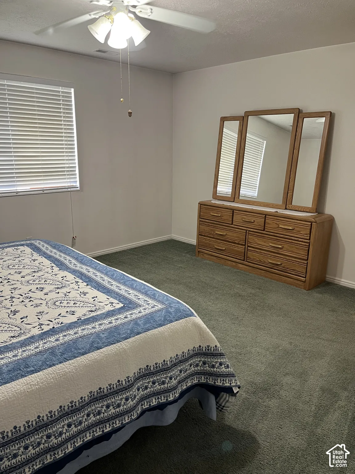 Recessed lighting, wall-to-wall carpeting, and a window with blinds