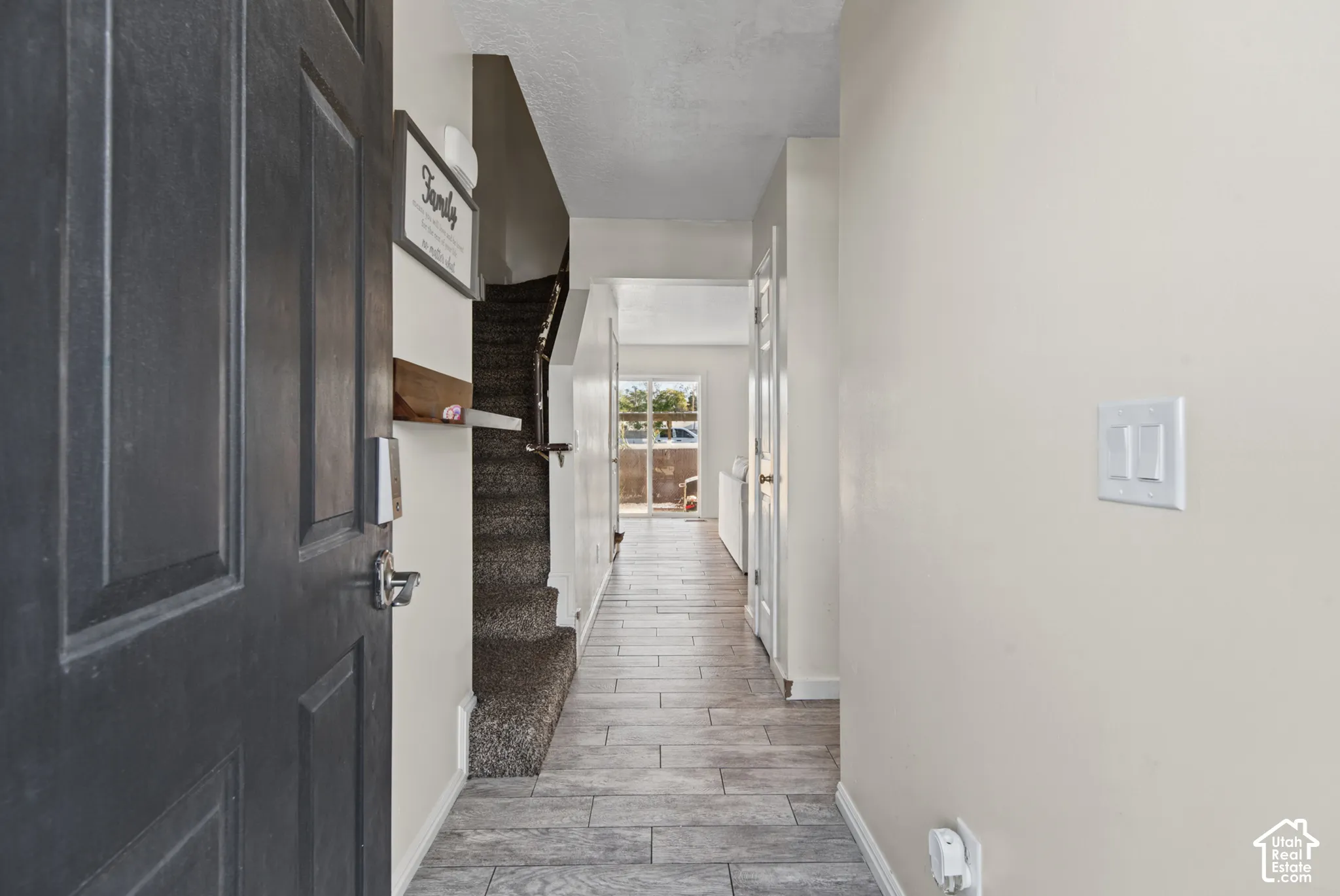 Wood-finish flooring throughout the hallway