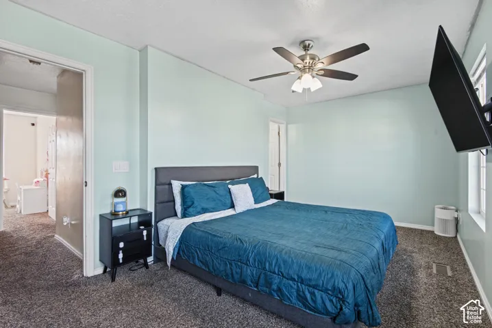 Recessed lighting, light blue wall paint, ceiling fan, and carpet flooring