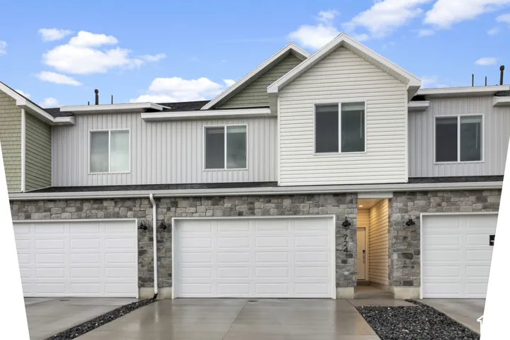 Modern multi-level exterior with vertical siding and stone accents