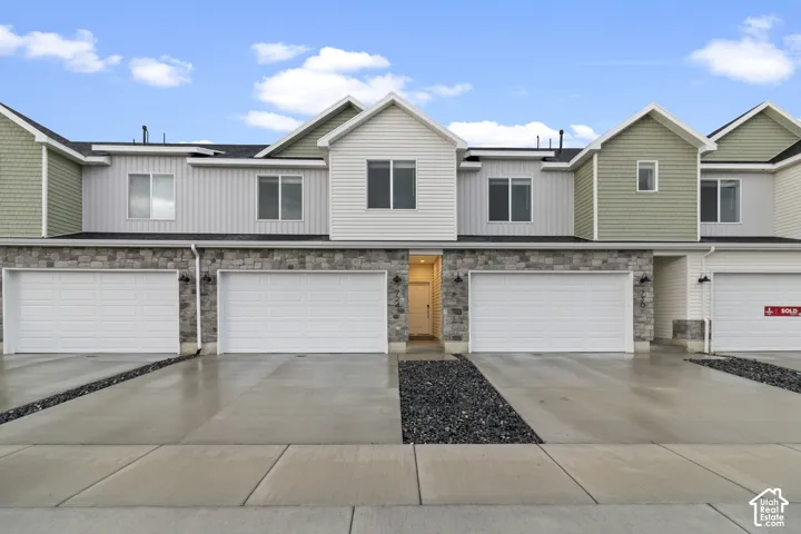 Stone veneer and siding exterior with multiple pitched gables