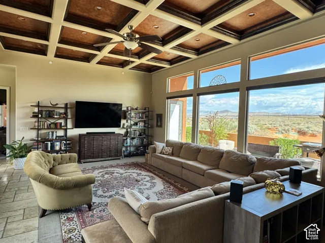 Coffered ceiling with recessed lighting and a ceiling fan