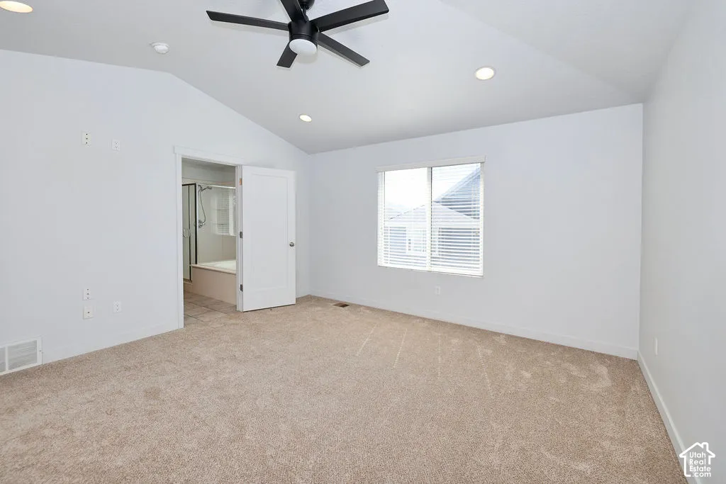 Vaulted ceiling featuring a matte black ceiling fan and recessed lighting, paired with neutral carpeting and a single window with blinds