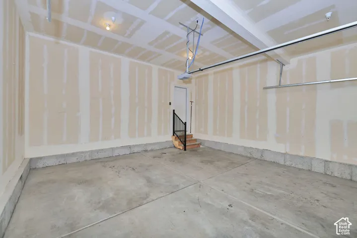 Attached overhead garage door track system