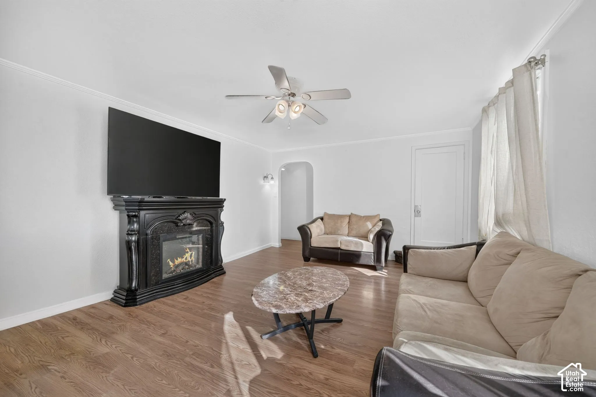 Wood-finish flooring throughout, complemented by a decorative fireplace