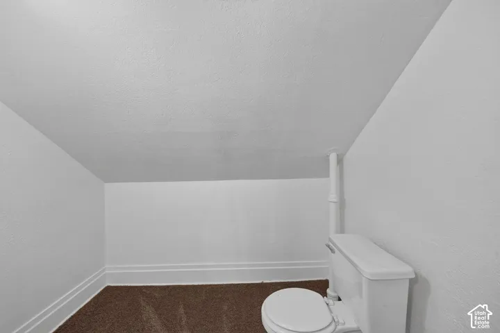 White two-piece toilet with a white seat