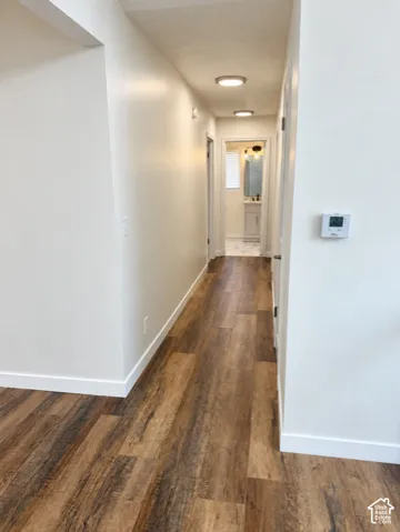 Wood-finish flooring throughout the hallway