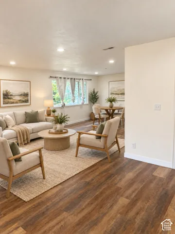Recessed lighting, wood-finish flooring, and white walls