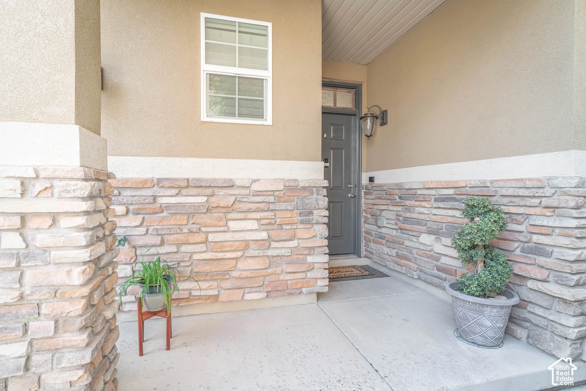 Stucco exterior with a stone veneer accent