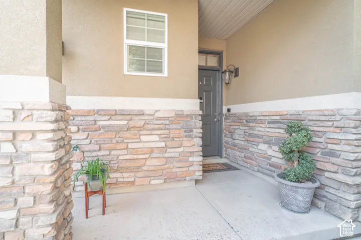 Stucco exterior with a stone veneer accent