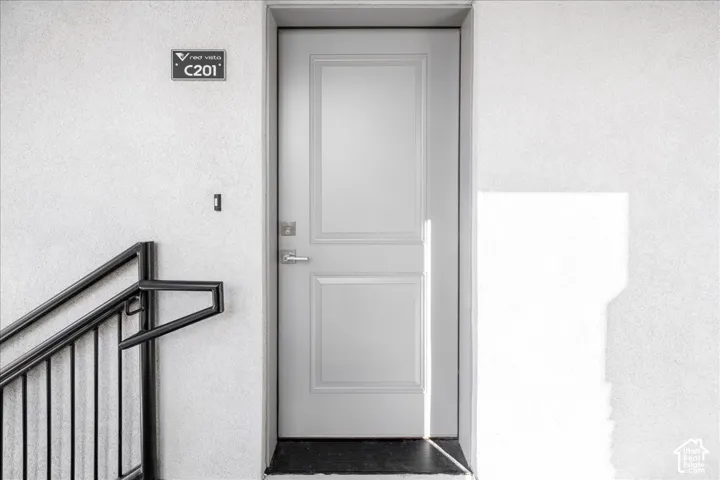 Panel door with brushed nickel hardware and black threshold
