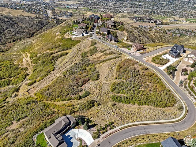 Expansive hillside property with established roads and surrounding residential development