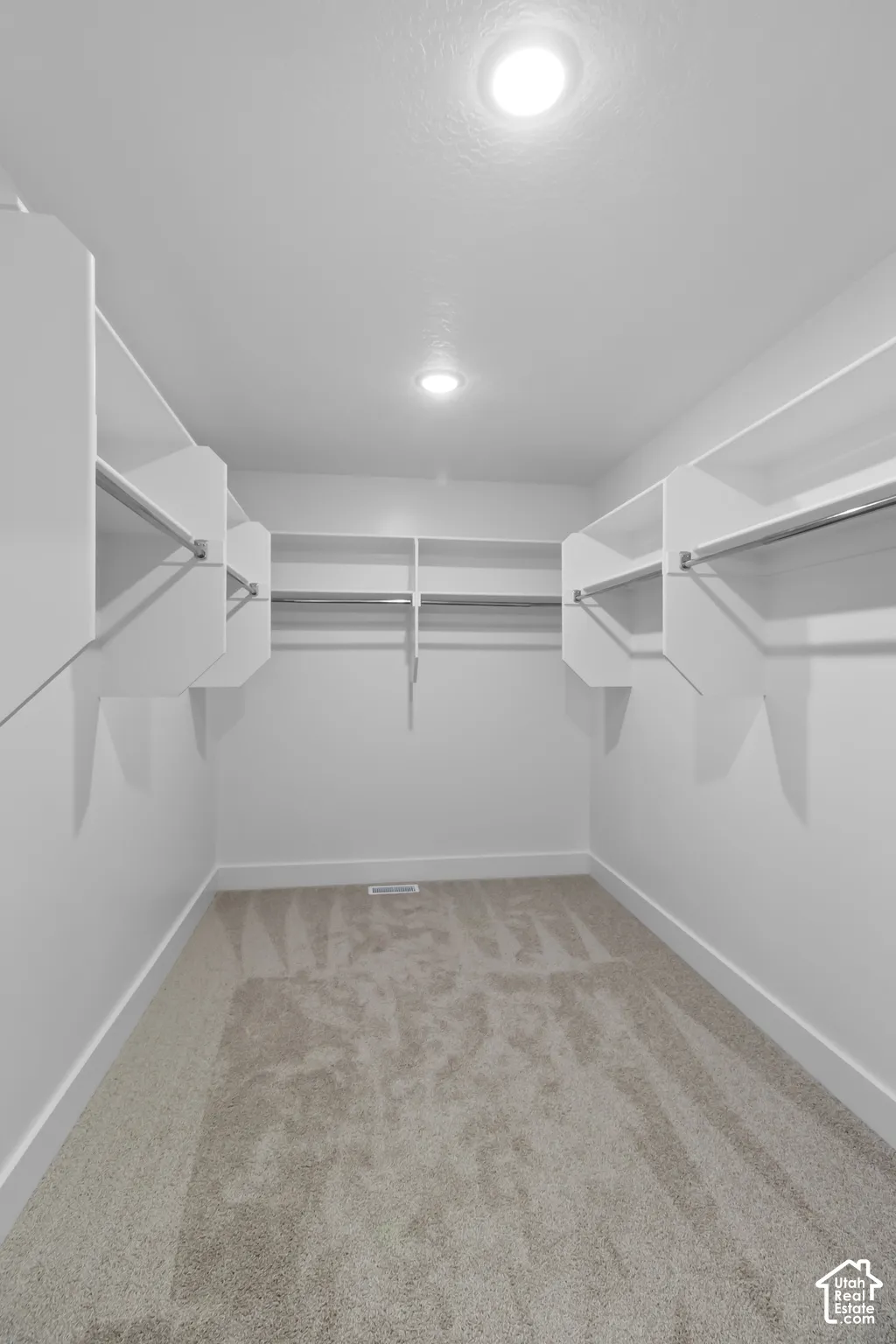 Primary bedroom walk-in closet