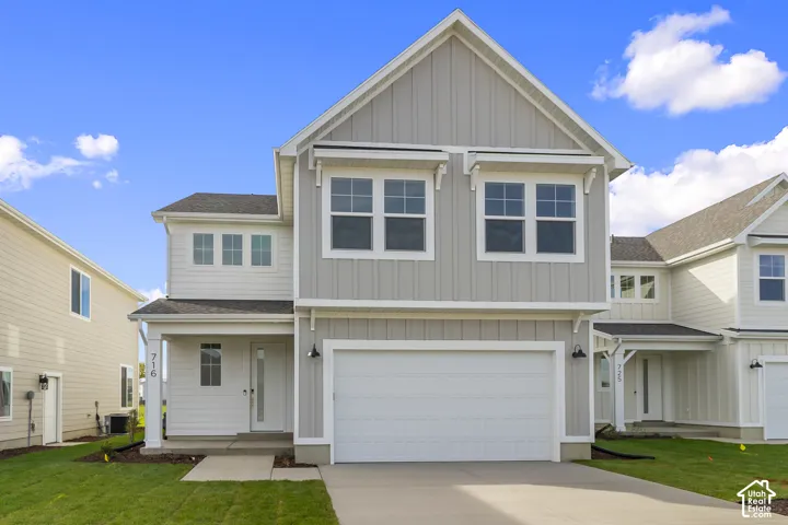 Contemporary exterior with light gray vertical siding and white trim