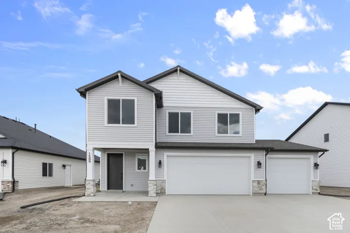 Two-story exterior with light gray siding and dark trim