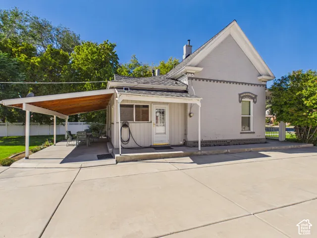 Concrete patio with wood-finish ceiling covering