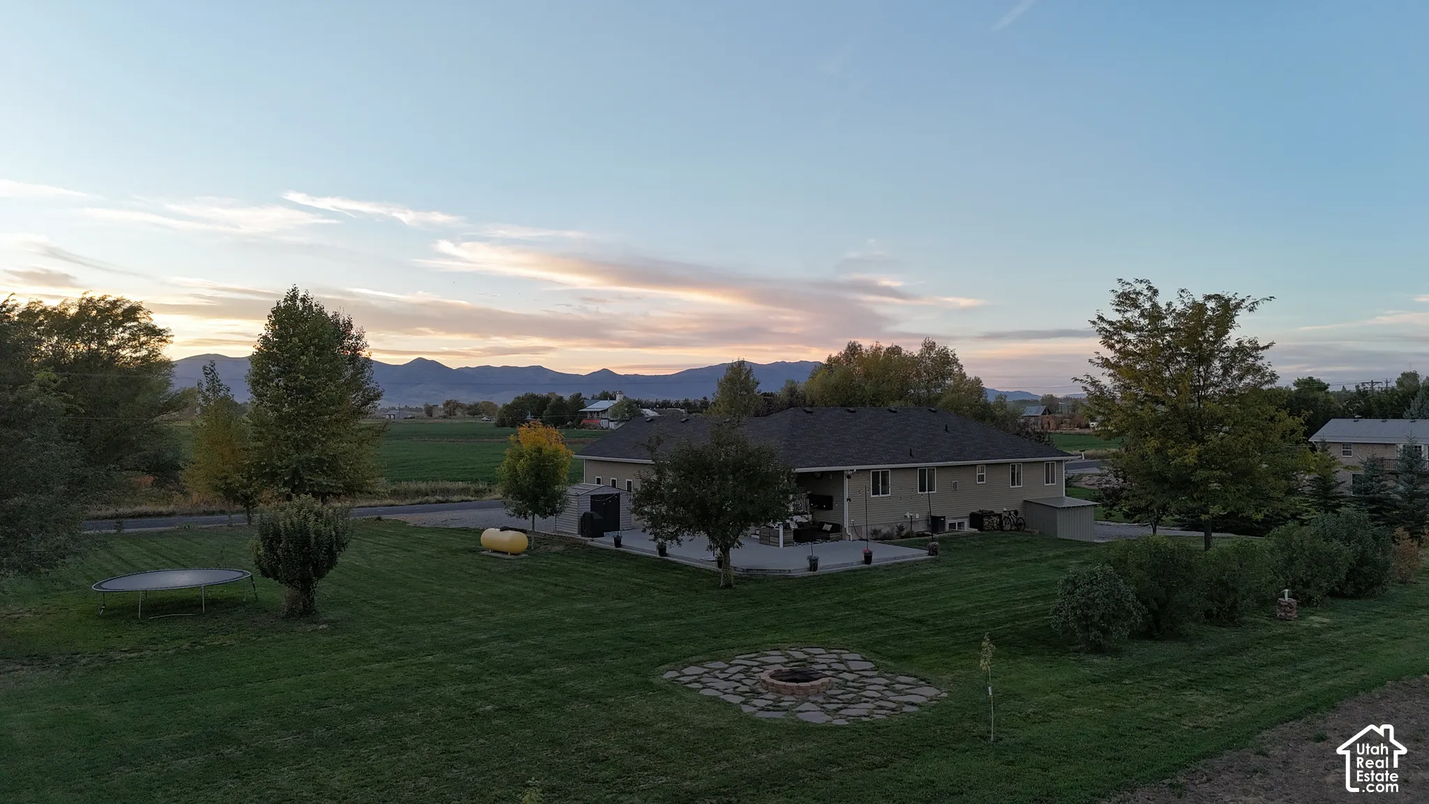 Expansive green lawn with mountain backdrop