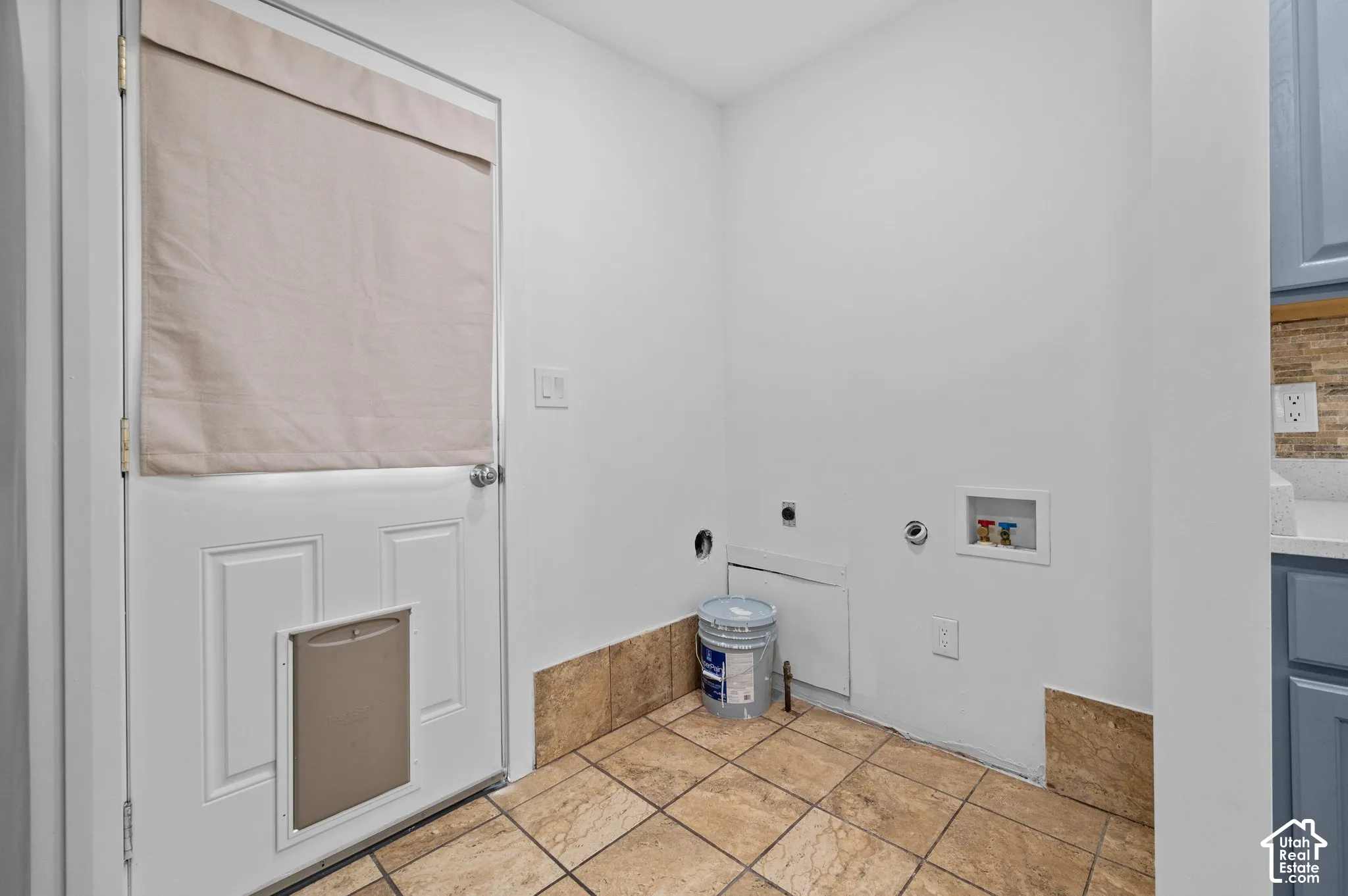 Laundry area and door to backyard from kitchen.