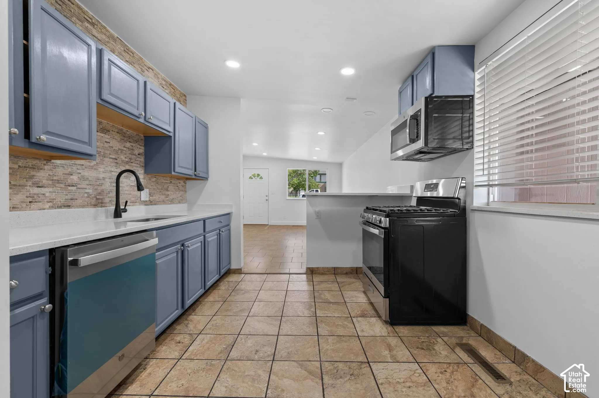 View from kitchen to living room. Newer appliances