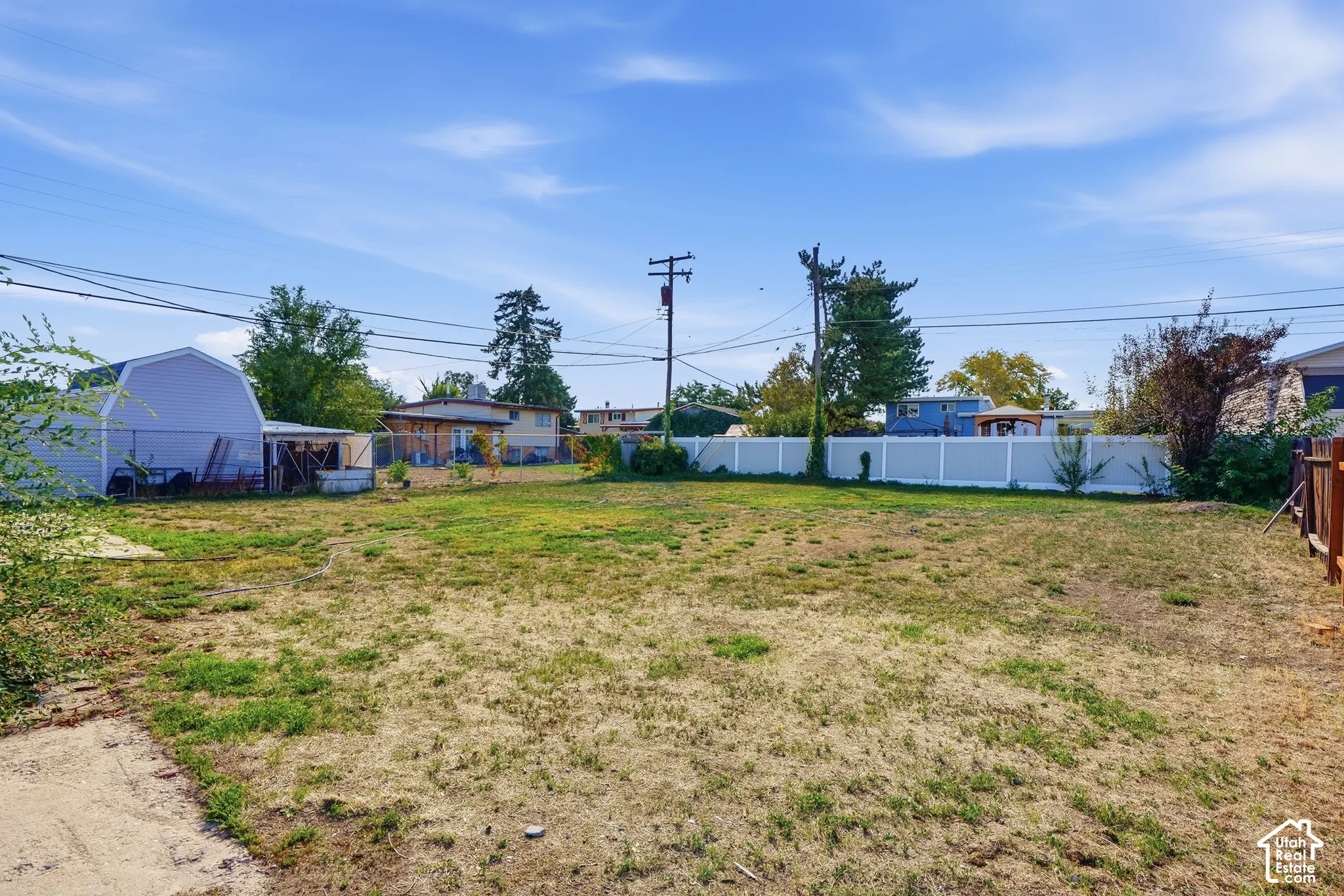 Expansive lot featuring a partial privacy fence