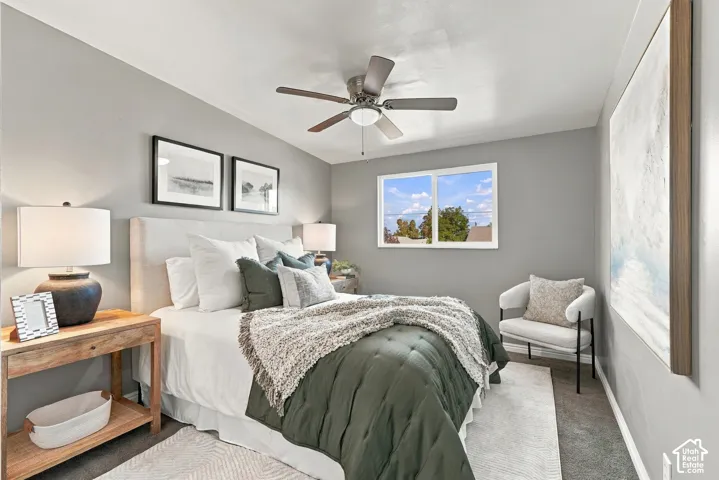 Recessed lighting, ceiling fan, carpet flooring, dual-pane window, and light gray wall paint