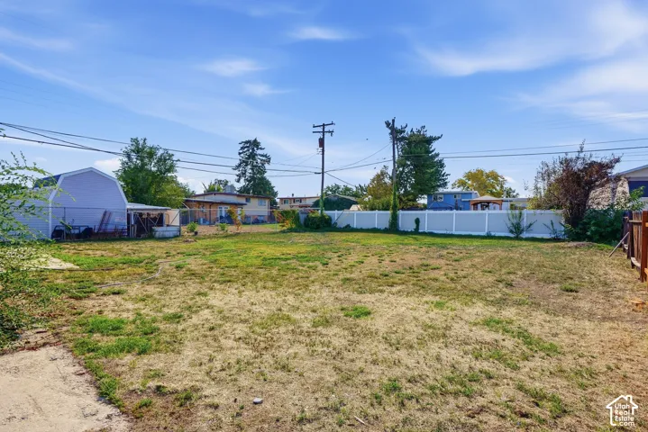 Expansive lot featuring a partial privacy fence
