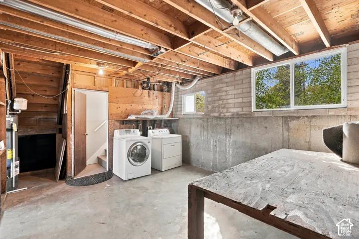 Exposed wood beam ceiling, concrete block walls, and multiple windows
