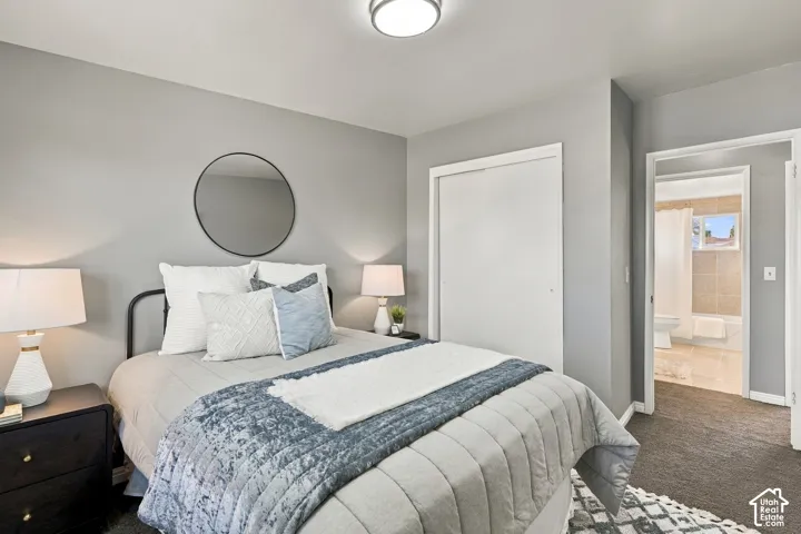 Recessed lighting, light gray wall paint, and dark carpet flooring