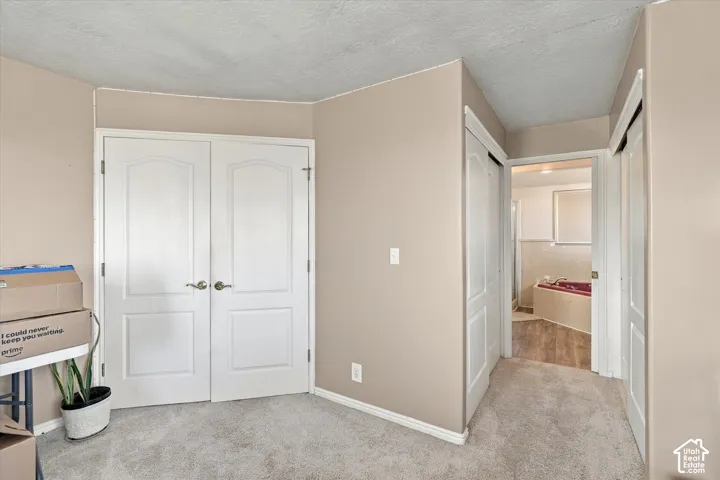 Neutral-toned walls with textured carpeting