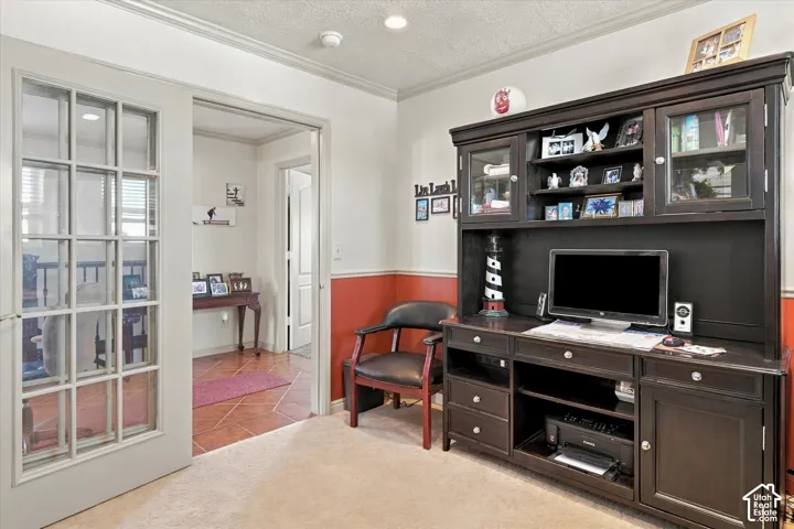 Carpeted room with crown molding, two-tone painted walls, and recessed lighting