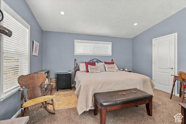 Recessed lighting and two windows with blinds