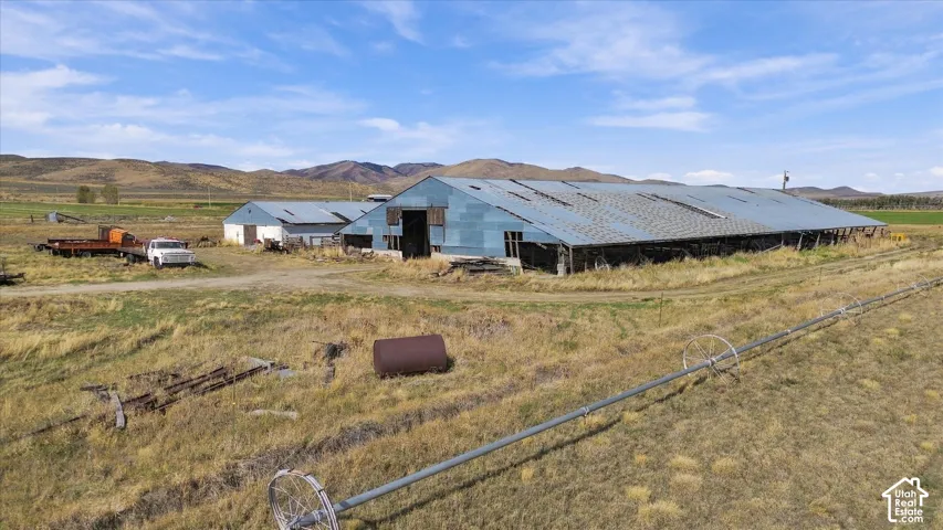 Multiple agricultural buildings with metal roofs