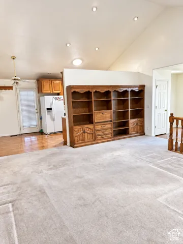 Vaulted ceiling with recessed lighting and a skylight