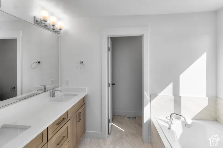 double vanity sinks with separate soaker tub and walk in shower