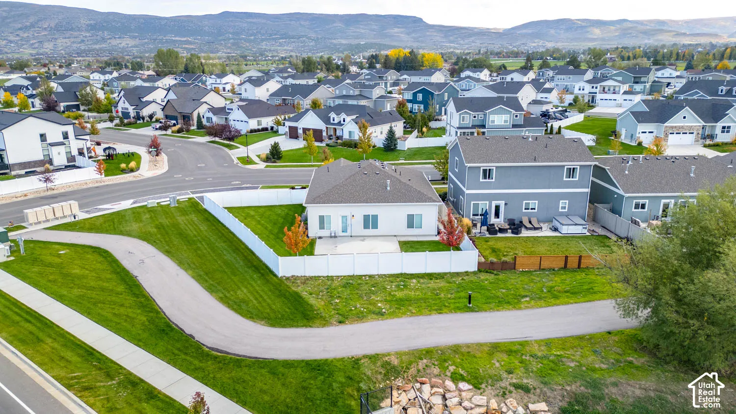 Property situated within a residential neighborhood with mountain backdrop