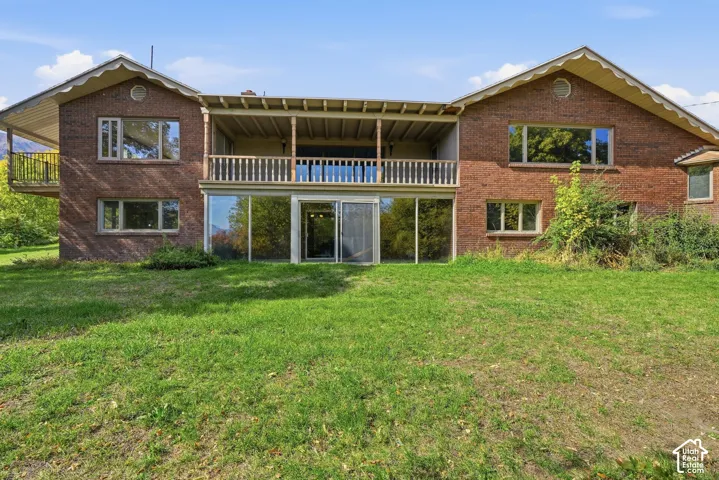 Brick exterior with a covered upper-level balcony