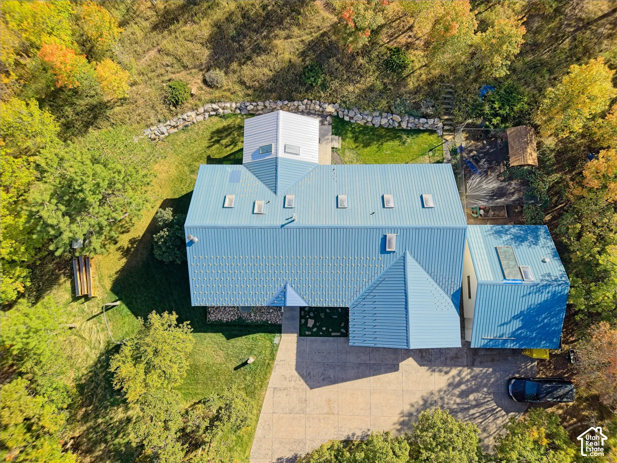 Blue metal roofing with multiple skylights