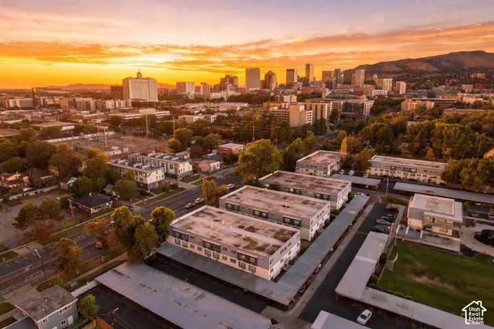 Multiple multi-story buildings with flat roofs and covered parking