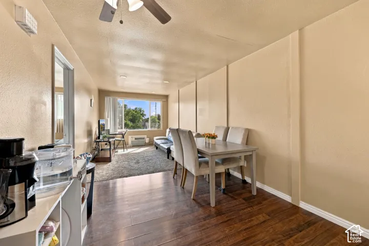 Wood-finish flooring, recessed lighting, and a ceiling fan with integrated lighting