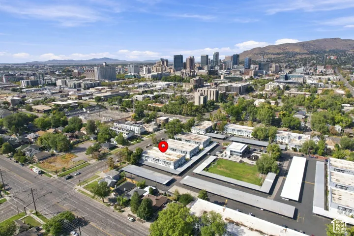 Urban setting with distant city skyline and surrounding mountainous terrain