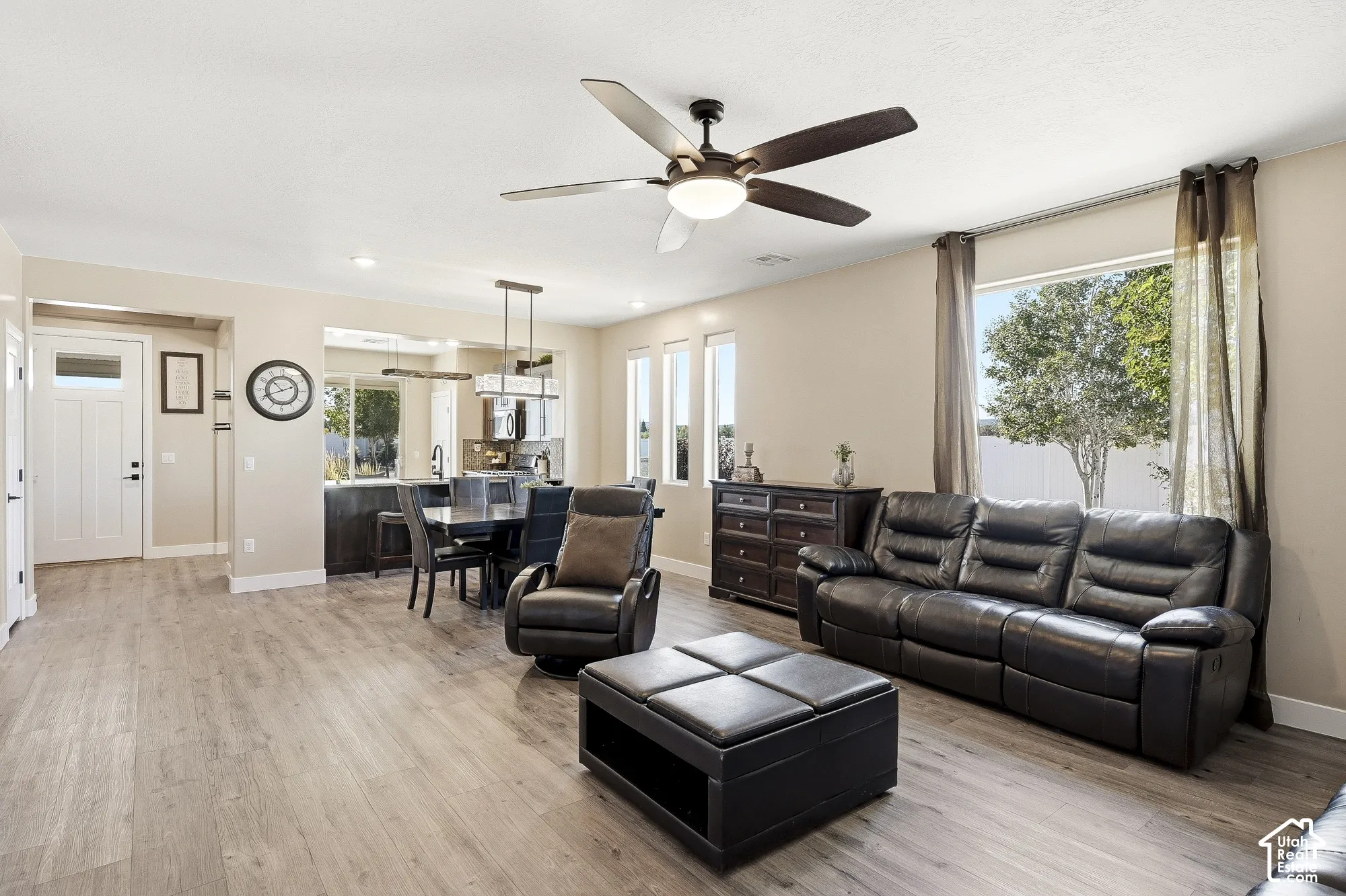 Open concept living area with wood-finish flooring