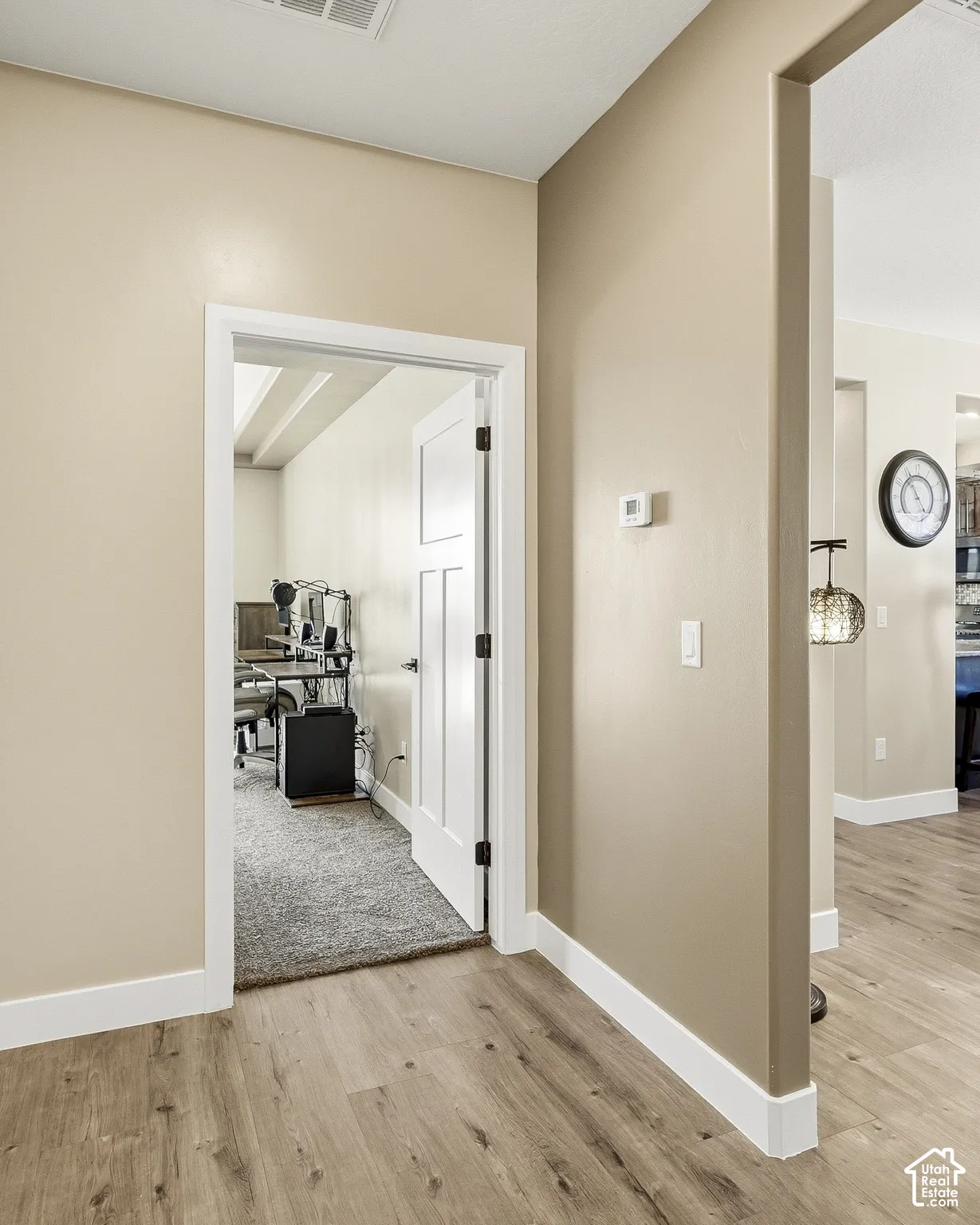 Wood-finish flooring throughout, complemented by a neutral wall palette