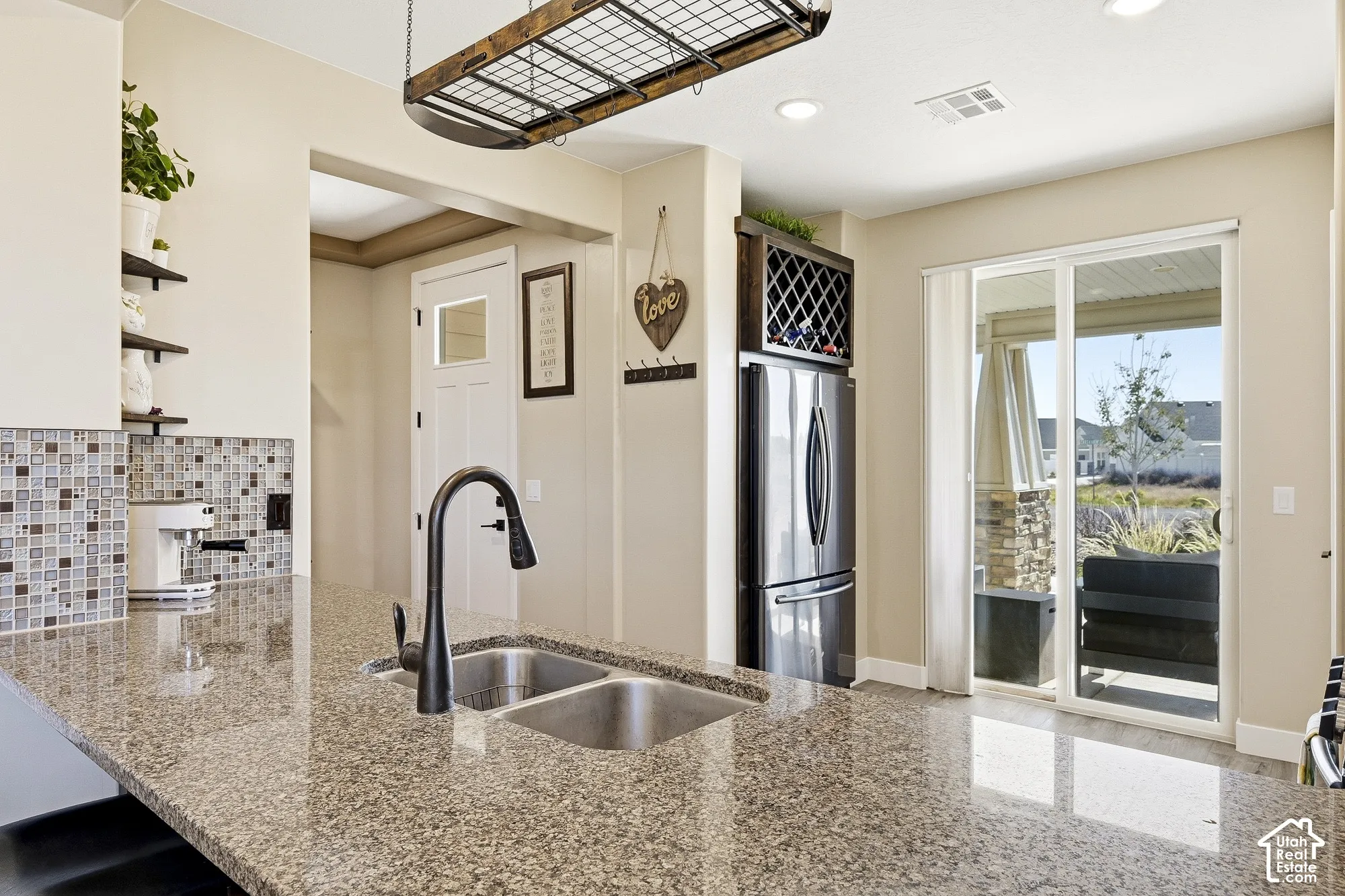 Spacious kitchen island with dual stainless steel sinks and a matte black faucet