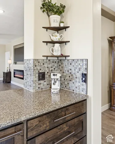 Granite countertop with a mosaic tile backsplash
