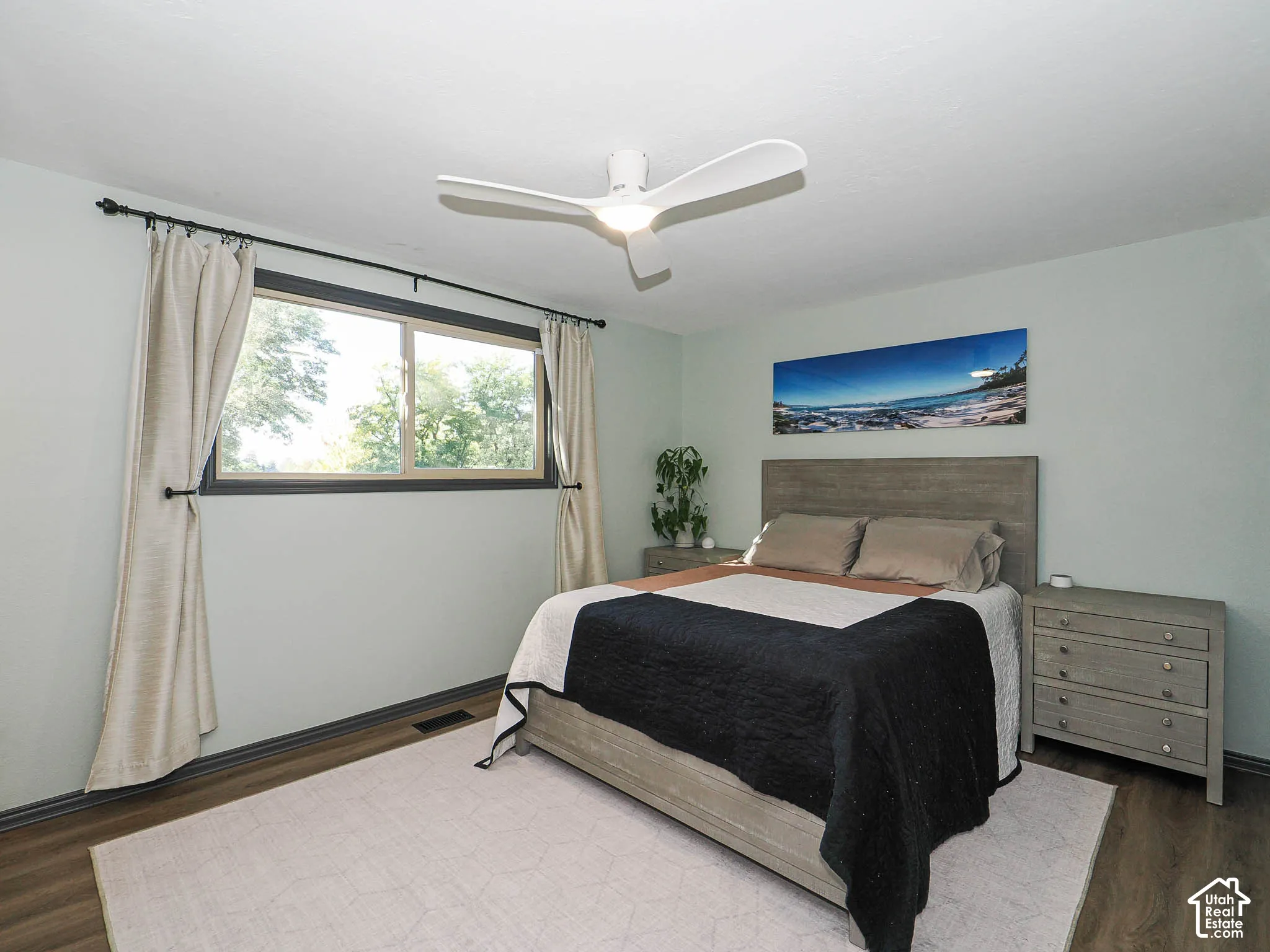 Recessed lighting, ceiling fan, wood-finish flooring, and a large window