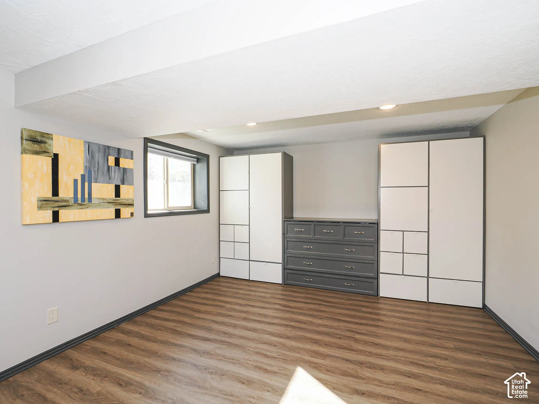 Recessed lighting, wood-finish flooring, and built-in storage cabinetry