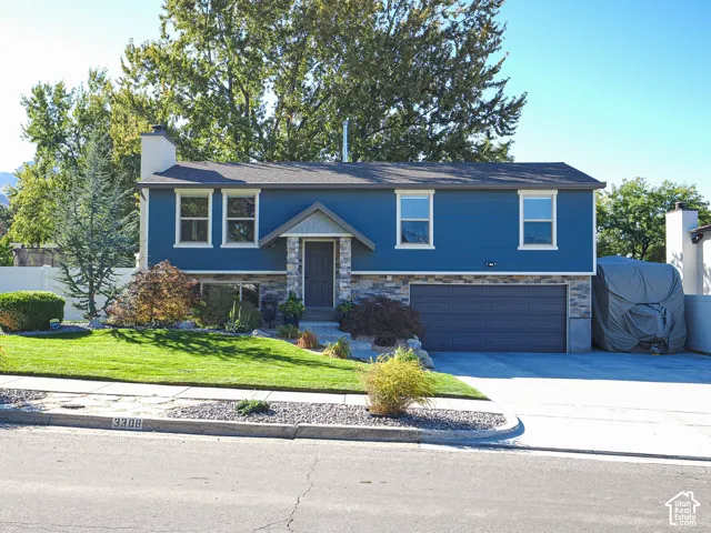Blue horizontal siding with stone veneer accents
