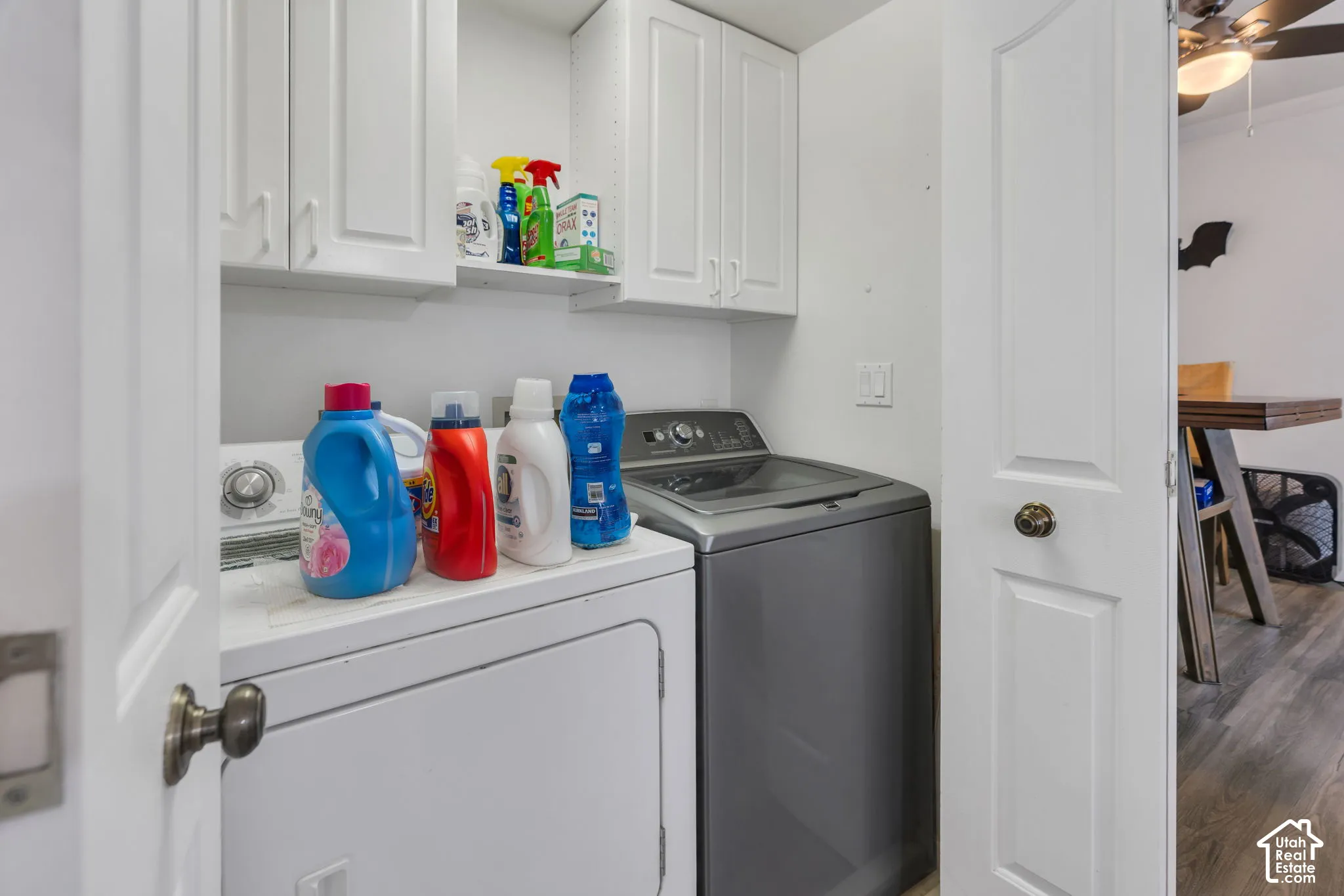 Built-in upper cabinetry and shelving provide storage